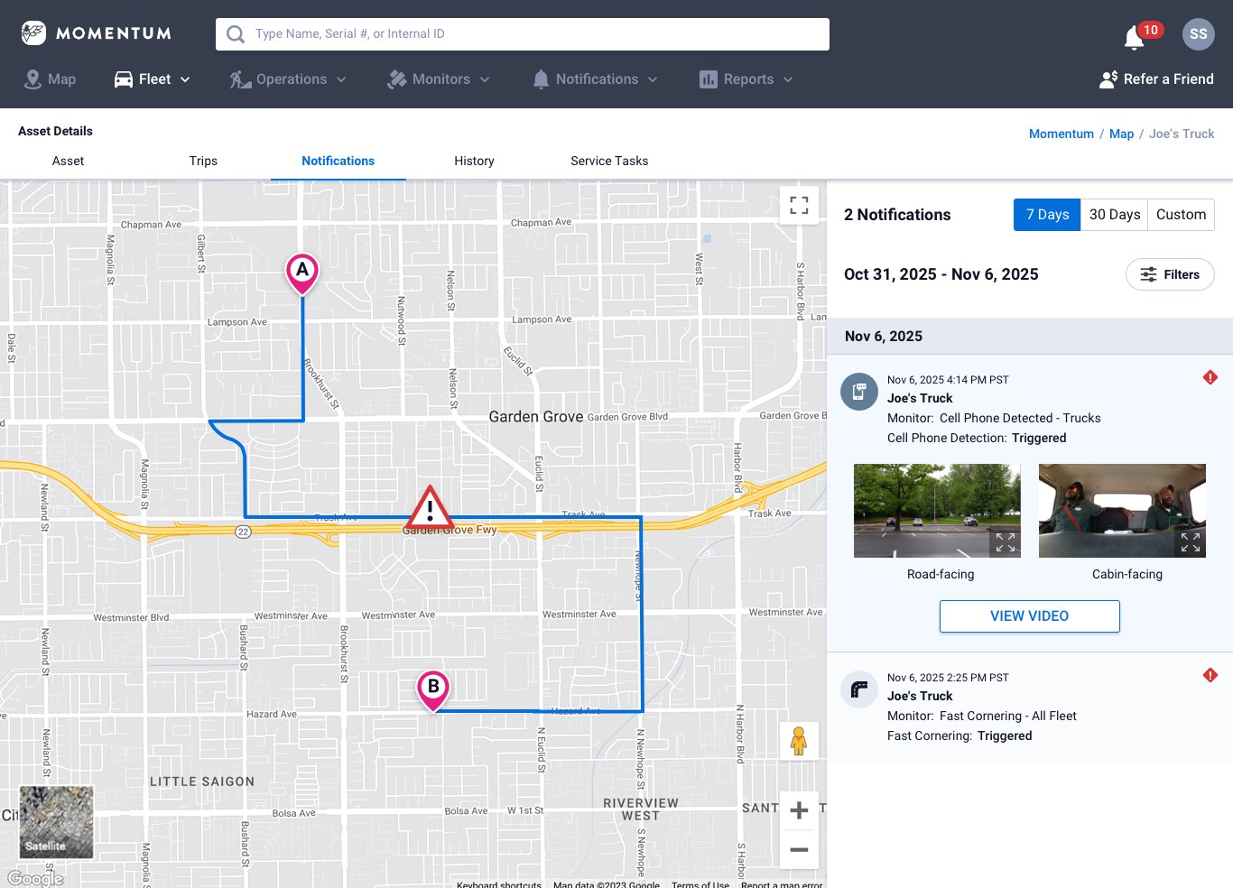 Web app notifications panel showing cell phone detection alert with road-facing and cabin-facing still images